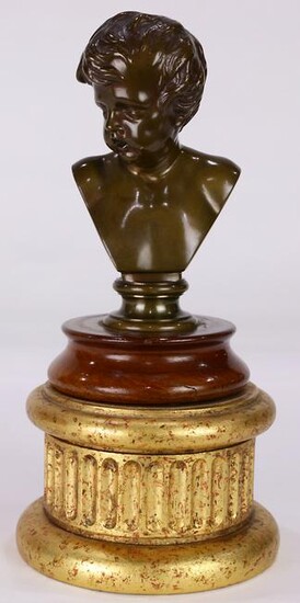 A continental patinated bronze bust of a young boy