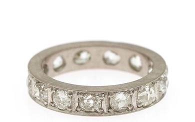 A diamond eternity ring set with numerous brilliant-cut diamonds, mounted in platinum. Size 54.