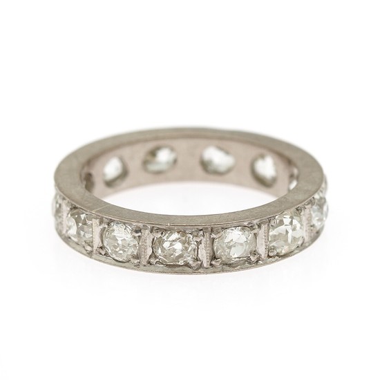 A diamond eternity ring set with numerous brilliant-cut diamonds, mounted in platinum. Size 54.
