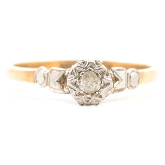 A diamond solitaire ring.