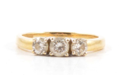 A diamond three stone ring.