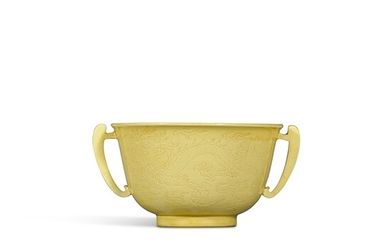 A fine incised yellow-glazed 'dragon' handled cup, Mark and period of Kangxi | 清康熙 黃釉暗刻雙龍戲珠紋雙耳小盃 《大清康熙年製》款
