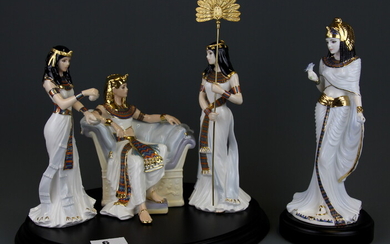A group of Royal Worcester 'Court of Tutankhamun' limited edition (395/500) porcelain figures on a wooden stand together with a Coalport lim