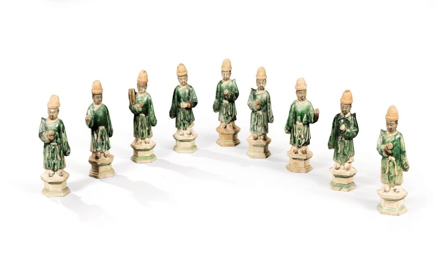 A group of nine glazed-pottery figures of attendants, China, Ming Dynasty