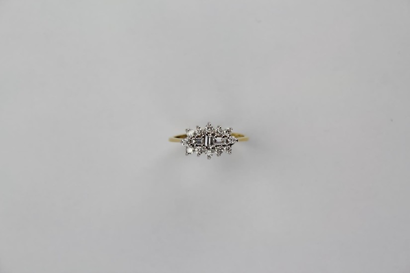 A ladies 18 carat gold diamond and baguette cluster ring, mo...