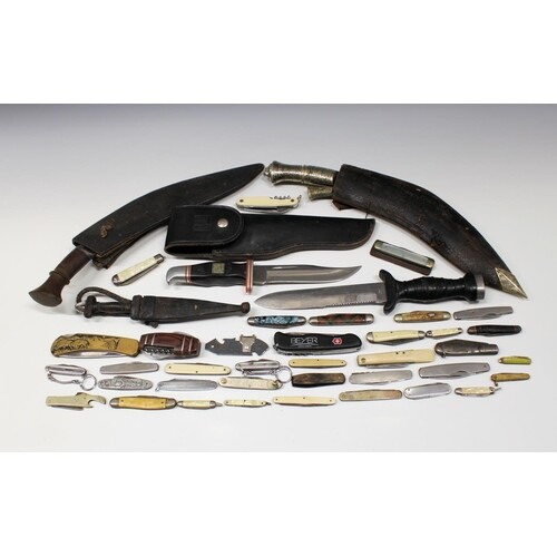 A large collection of knives of varying types, to include tw...