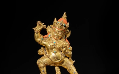 A large gilt-copper alloy figure of Vajrapani, Tibet, 13th century