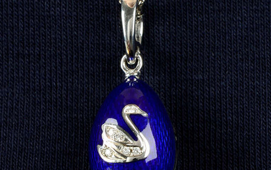 A limited edition 18ct gold diamond and blue enamel egg pendant, by Fabergé.