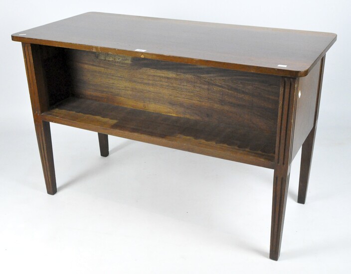 A mahogany hall table with open compartments to the long sides, on fluted supports