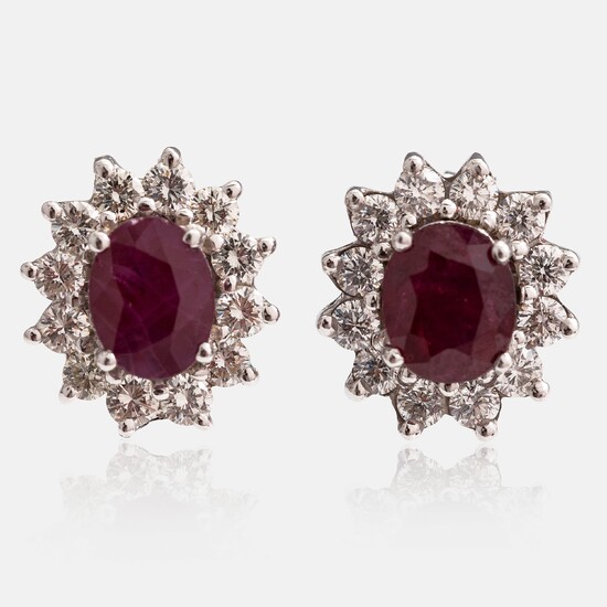 A pair of 18K white gold earrings with brilliant cut diamonds ca. 0.96 ct in total and rubies. Rubens, Helsinki.