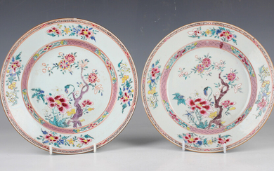 A pair of Chinese famille rose porcelain plates, Yongzheng period, each painted with flowers, diamet