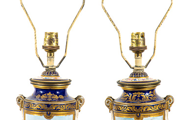 A pair of French porcelain Sevres style table lamps of...