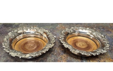 A pair of Regency Old Sheffield plate wine coasters, the rim...