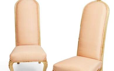A pair of Rococo style giltwood slipper chairs