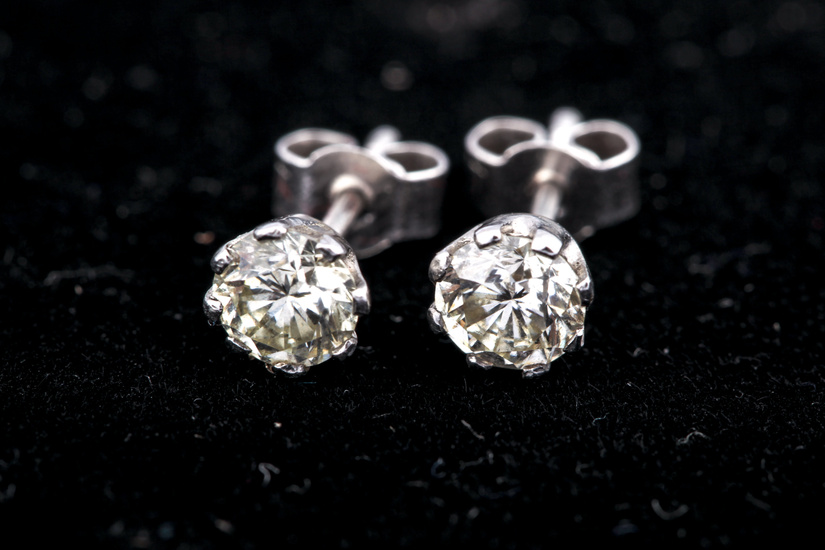 A pair of diamond stud earrings. The round brilliants each approx. 0.50cts (1.