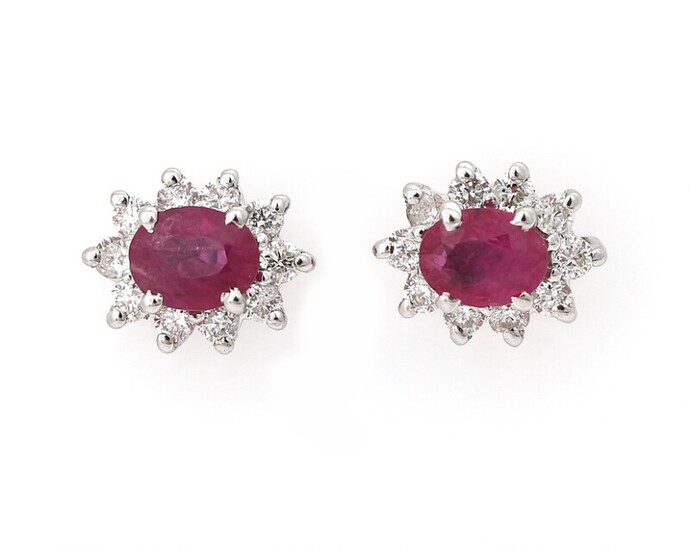 NOT SOLD. A pair of ear studs each set with a ruby encircled by diamonds...