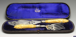 A pair of early Victorian silver and ivory handled fish servers.