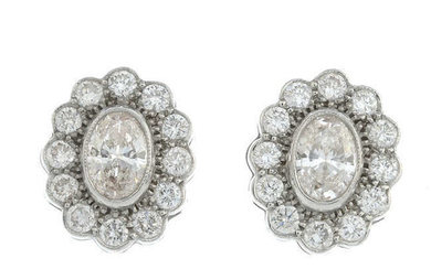 A pair of oval-shape 'pink' diamond and brilliant-cut diamond earrings.