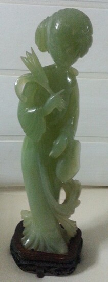 A pale green jadeite woman sculpture on zitan wood...