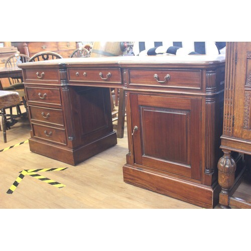 A reproduction mahogany pedestal desk, fitted six drawers, a...