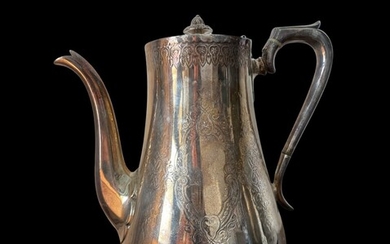 A silver-plated English teapot from 1871