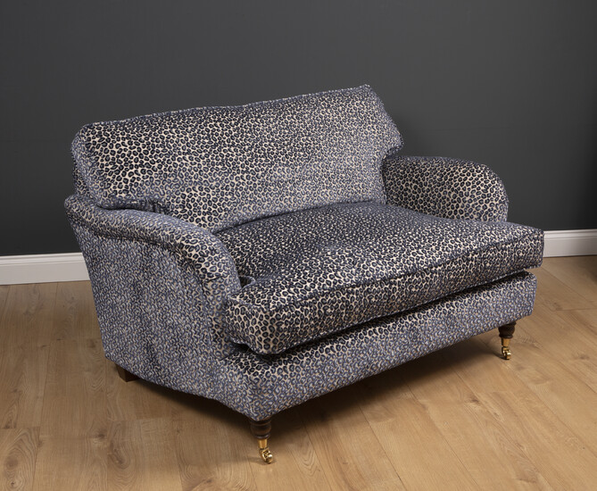 A small modern deep two seater sofa