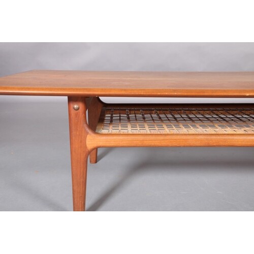 A teak crossbanded coffee table, rectangular, with wicker un...