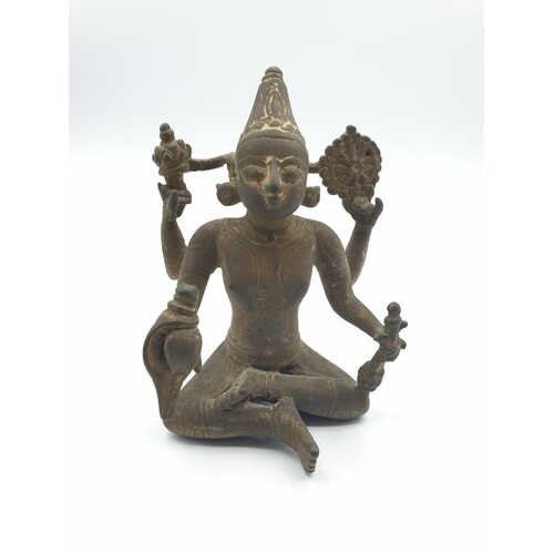 A very early Oriental religious figure with 4 arms cast in b...