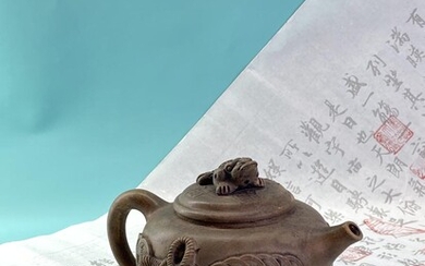 A white clay “YiXing” 宜兴 teapot with three-legged toad...