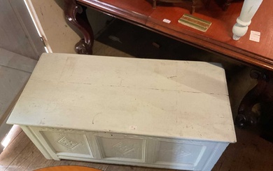 A white painted oak coffer with carved and panelled front,...