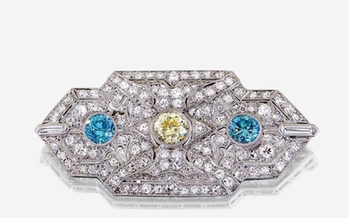 A yellow diamond, diamond, zircon, and fourteen karat white gold pendant/brooch, Raymond Yard