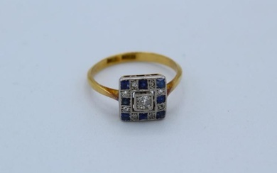 An Art Deco diamond and sapphire panel ring. Stamped "18ct...