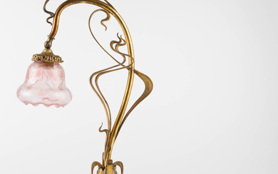 An Art Nouveau-period gilt-bronze and acid-etched cameo glass table lamp. Shade decorated with flor