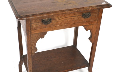 An Arts and Crafts oak side table.