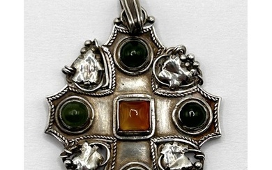 An Arts and Crafts silver coloured metal, green and amber st...