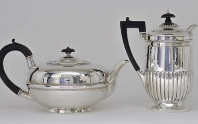 An Edward VII Silver Circular Tea Pot and a...