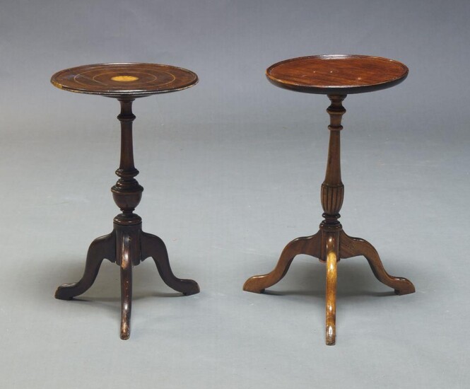 An Edwardian mahogany and inlaid wine table, the circular top centred by fan motif, on turned support to tripod legs, 49cm high, 29cm diameter, together with another mahogany wine table, 50cm high, 28cm diameter (2)