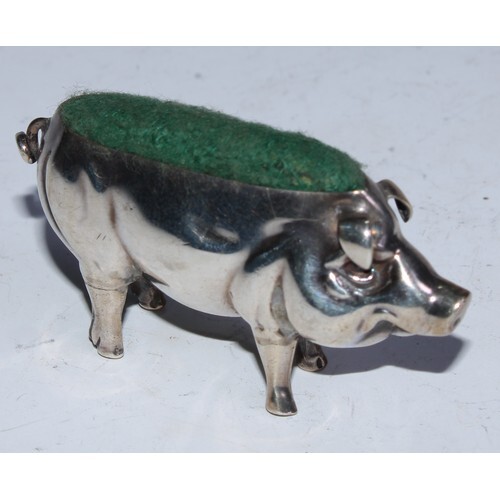 An Edwardian silver novelty pin cushion, as a pig, 6cm long,...