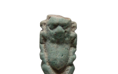 An Egyptian pale blue faience amulet of Bes