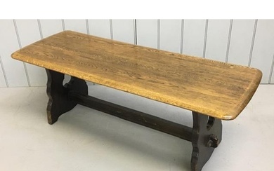 An Ercol-style coffee table, with stretchered base. Dimensio...