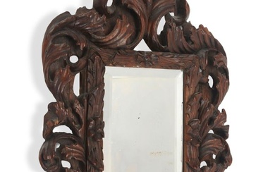 An Italian Baroque-style carved wood mirror