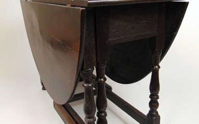 An early 18th century oak gate leg table base, the...