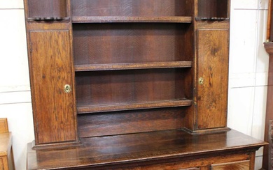 An early 19th century and later oak dresser