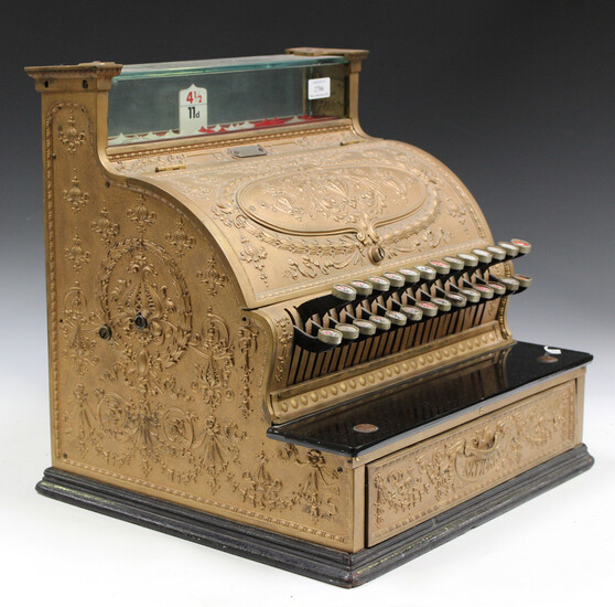 An early 20th century gilt painted cast metal National cash register, bearing serial number plaque &