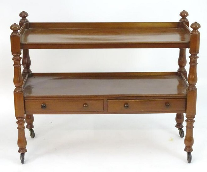 An early 20thC mahogany buffet with two tiers above two
