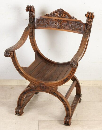 Antique walnut scissor chair with tendrils and