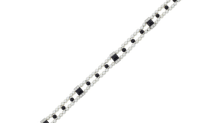 Art Deco Platinum, Diamond, Onyx and Pearl Bracelet and Platinum, Gold, Sapphire and Diamond Charm Bracelet