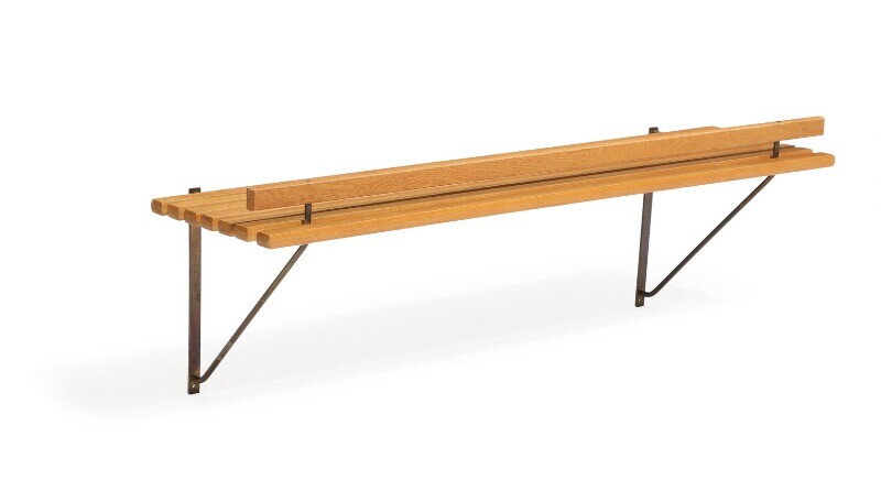 Danish design: A 1960s solid oak wall shelf with patinated brass fittings. L. 120 cm.