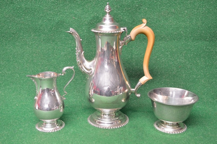 Elegant three piece silver tea set to comprise: teapot, suga...