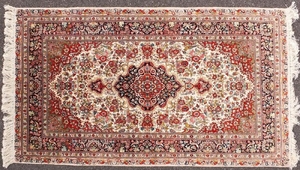 Fine rectangular silk rug having all over floral motifs, 155...